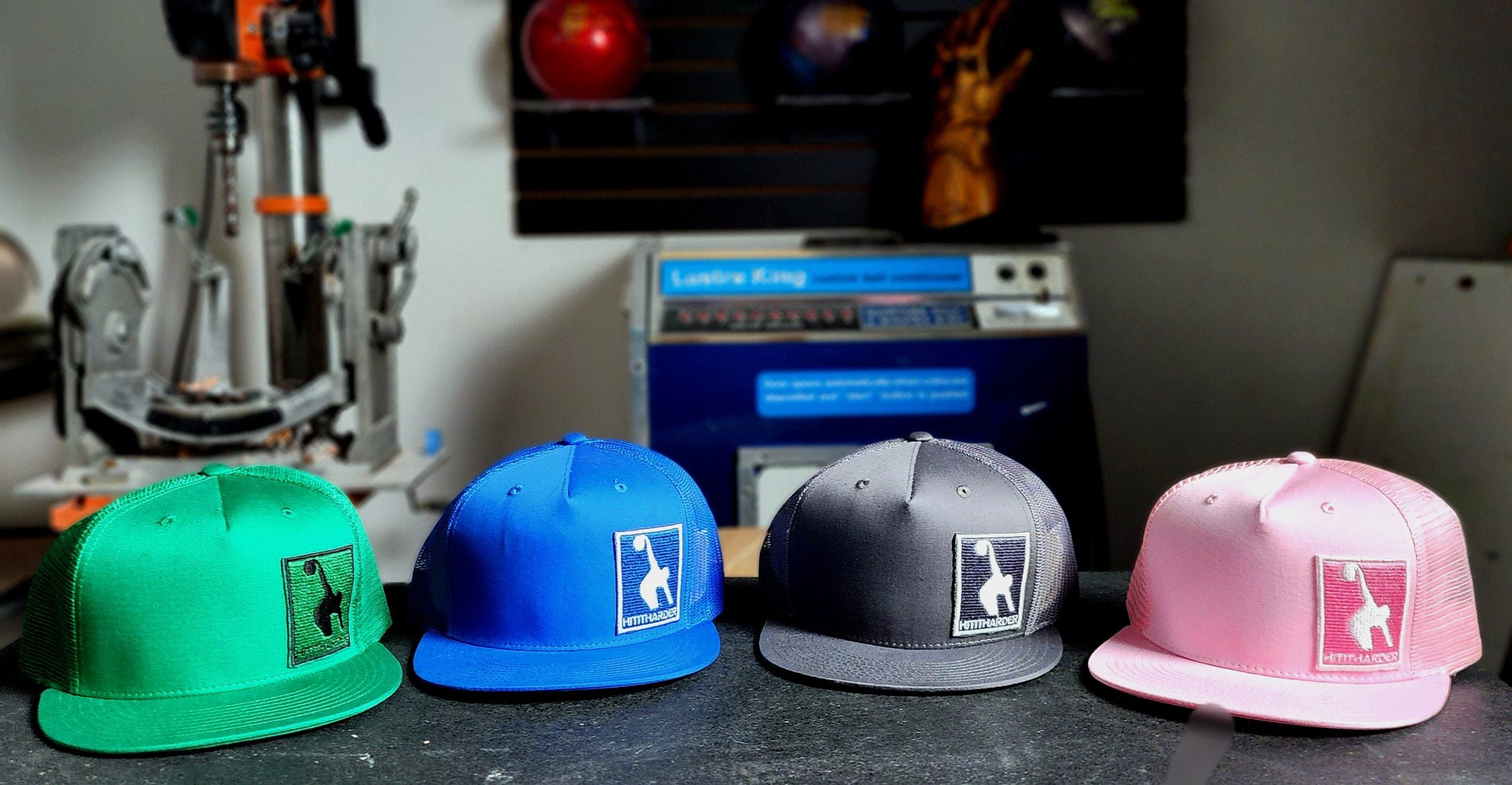 #Hititharder Trucker Hat